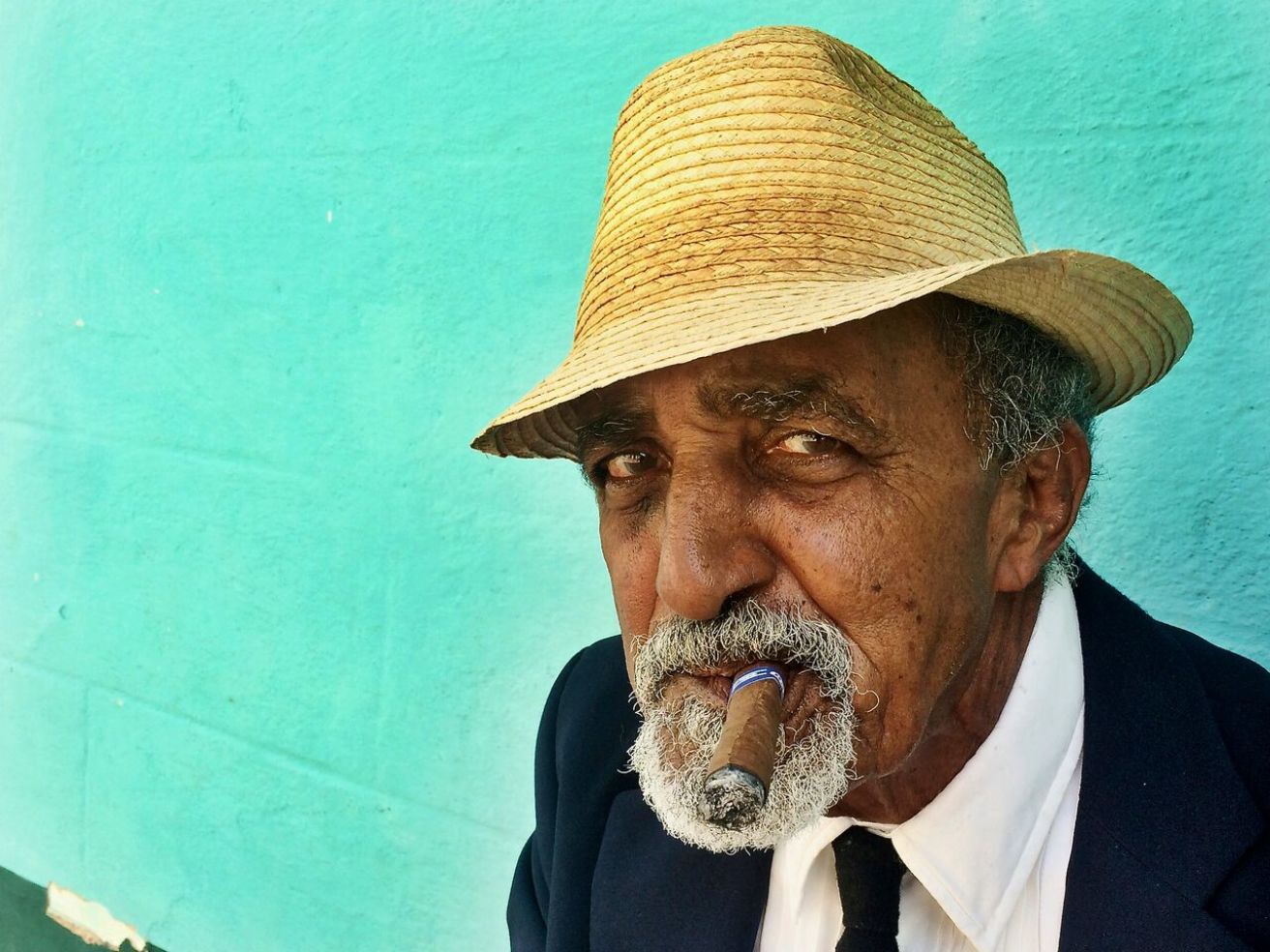 man with a cigar and a hat in Cuba