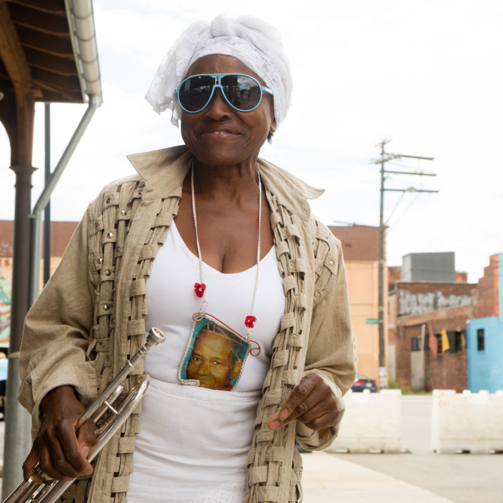 Maria Perfect Peace plays trumpet and sings classic jazz tunes outside Eastern Market.