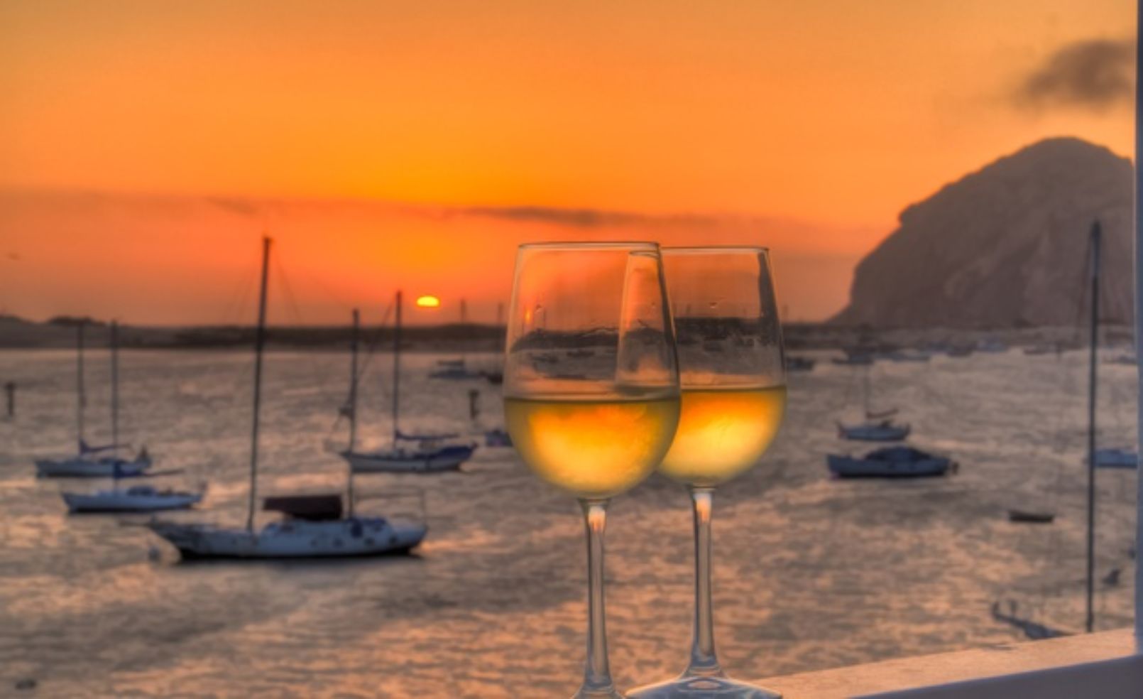 A glass of wine at sunset.