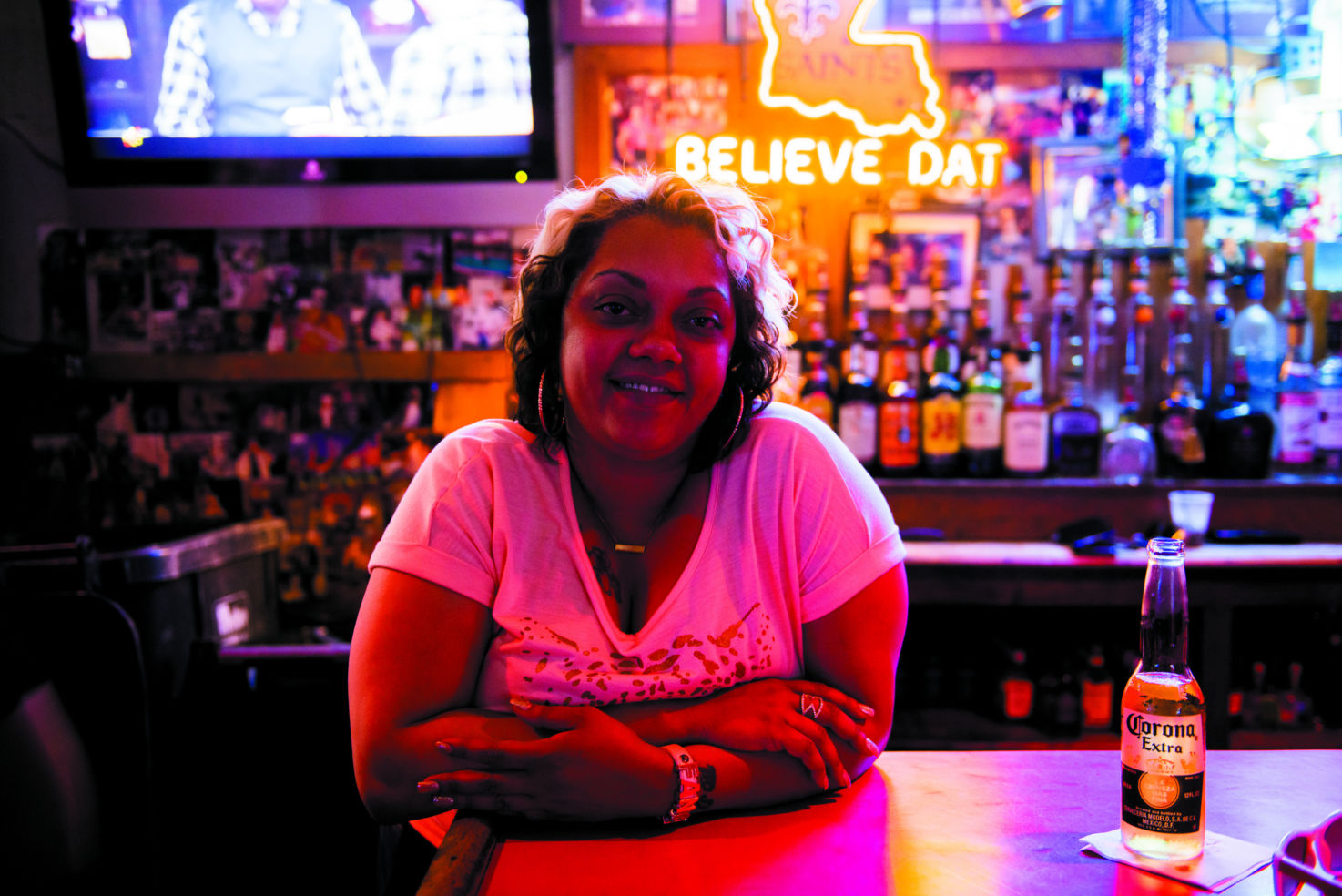 A bartender pauses to enjoy the live music
