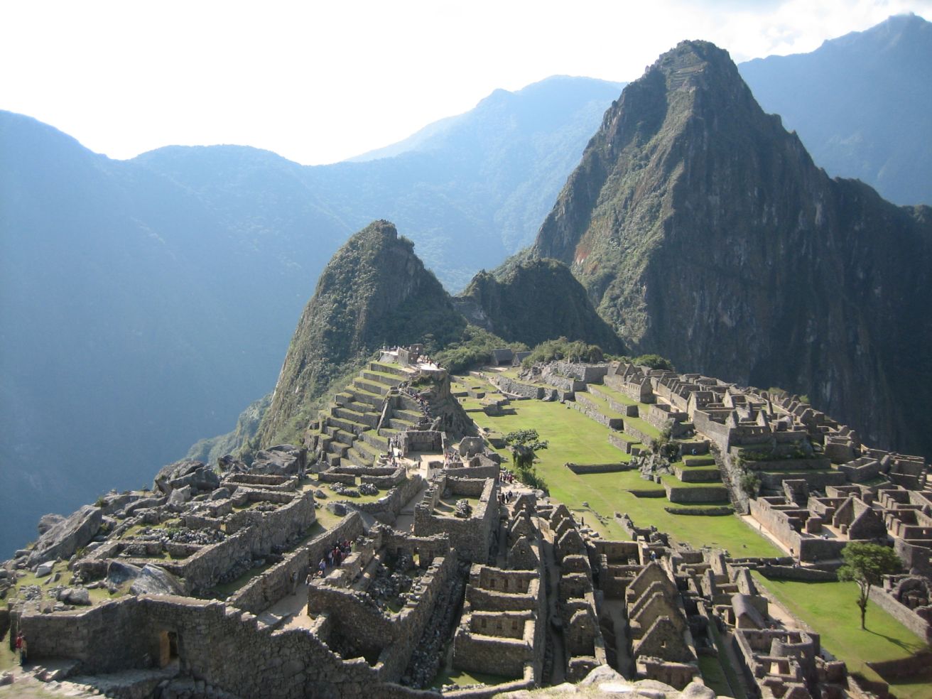 An aerial view of Machu Picchu, Peru, on a sunny day.