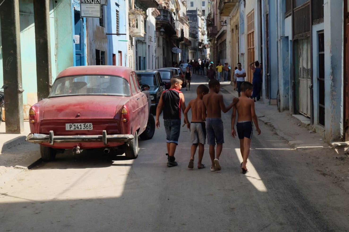 Red car on the street in Plaza Vieja