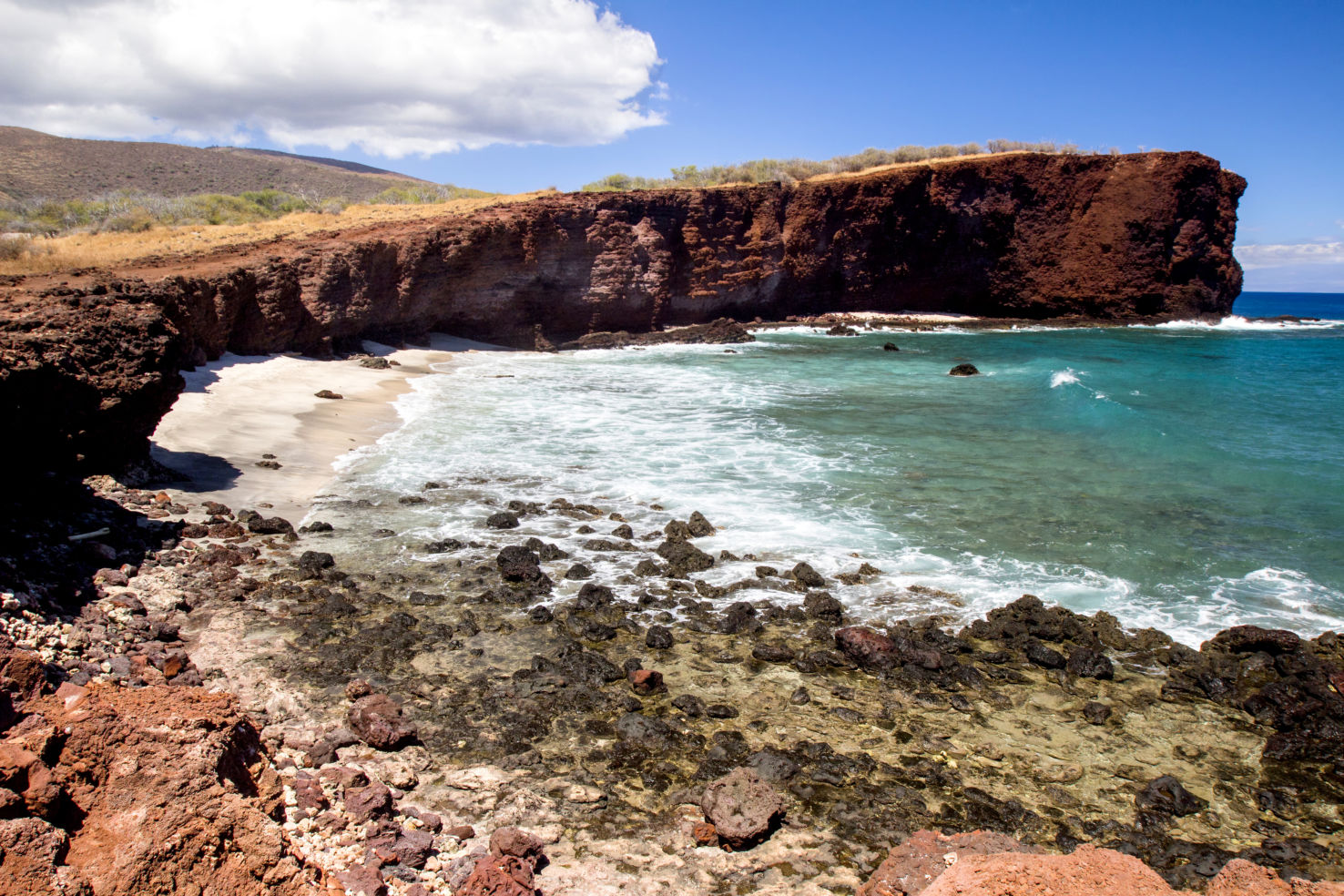Waves crash on the beach in Shark's Cove in Lanai.