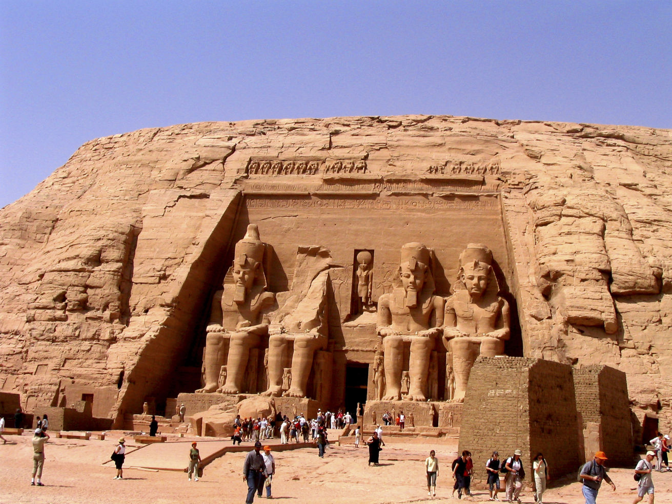 Tourists outside of a pyramid in Egypt
