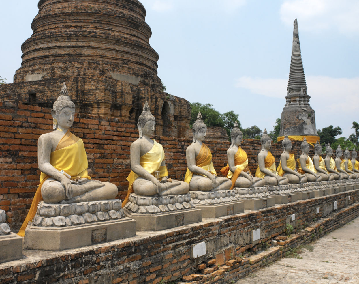 Buddhist statues and stupa in the ancient city of Ayutthaya in Thailand. The site dates from 1350
