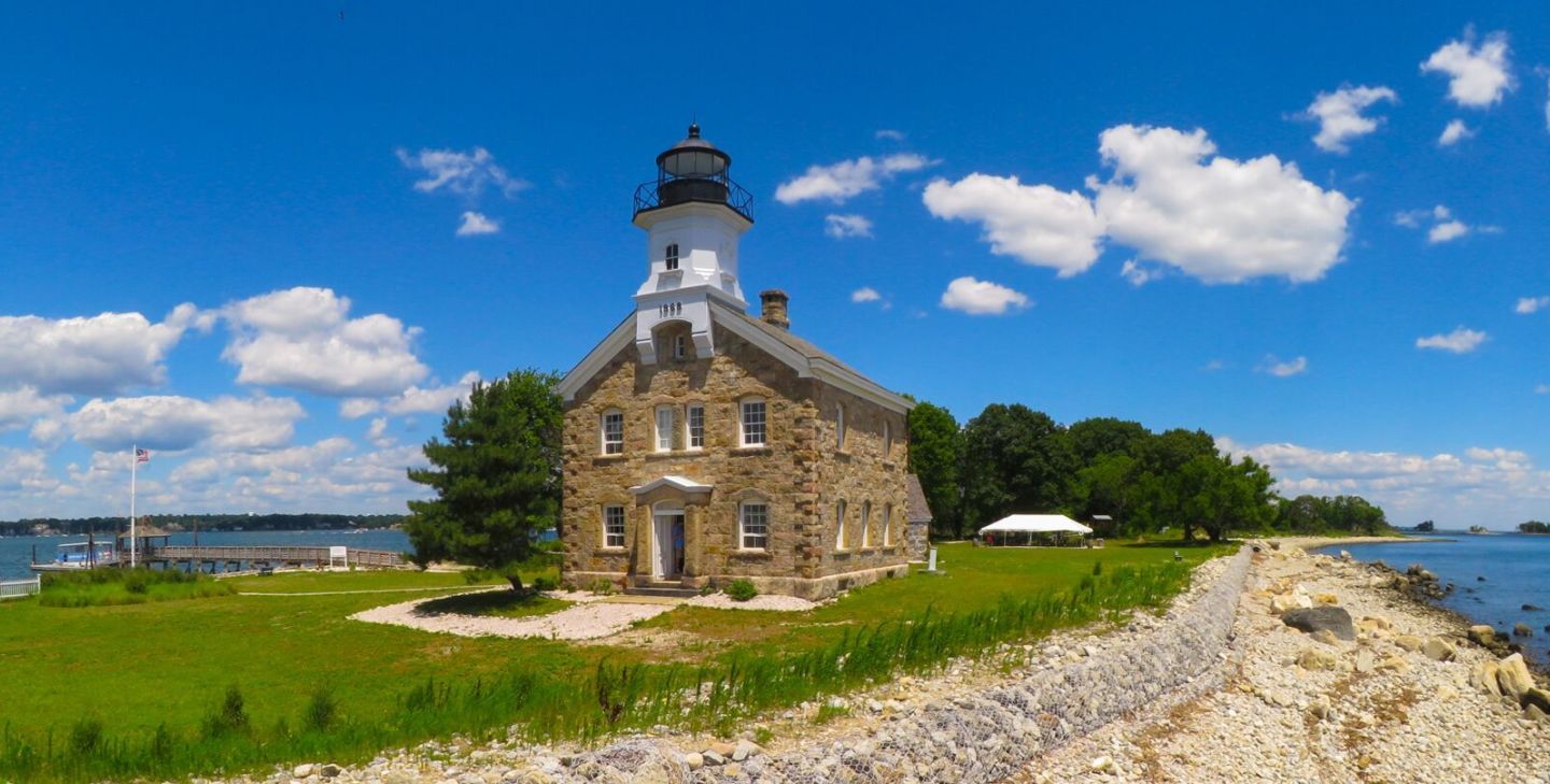 Stone Lighthouse in sunny day