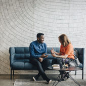 Two People Talking Using A Translator App