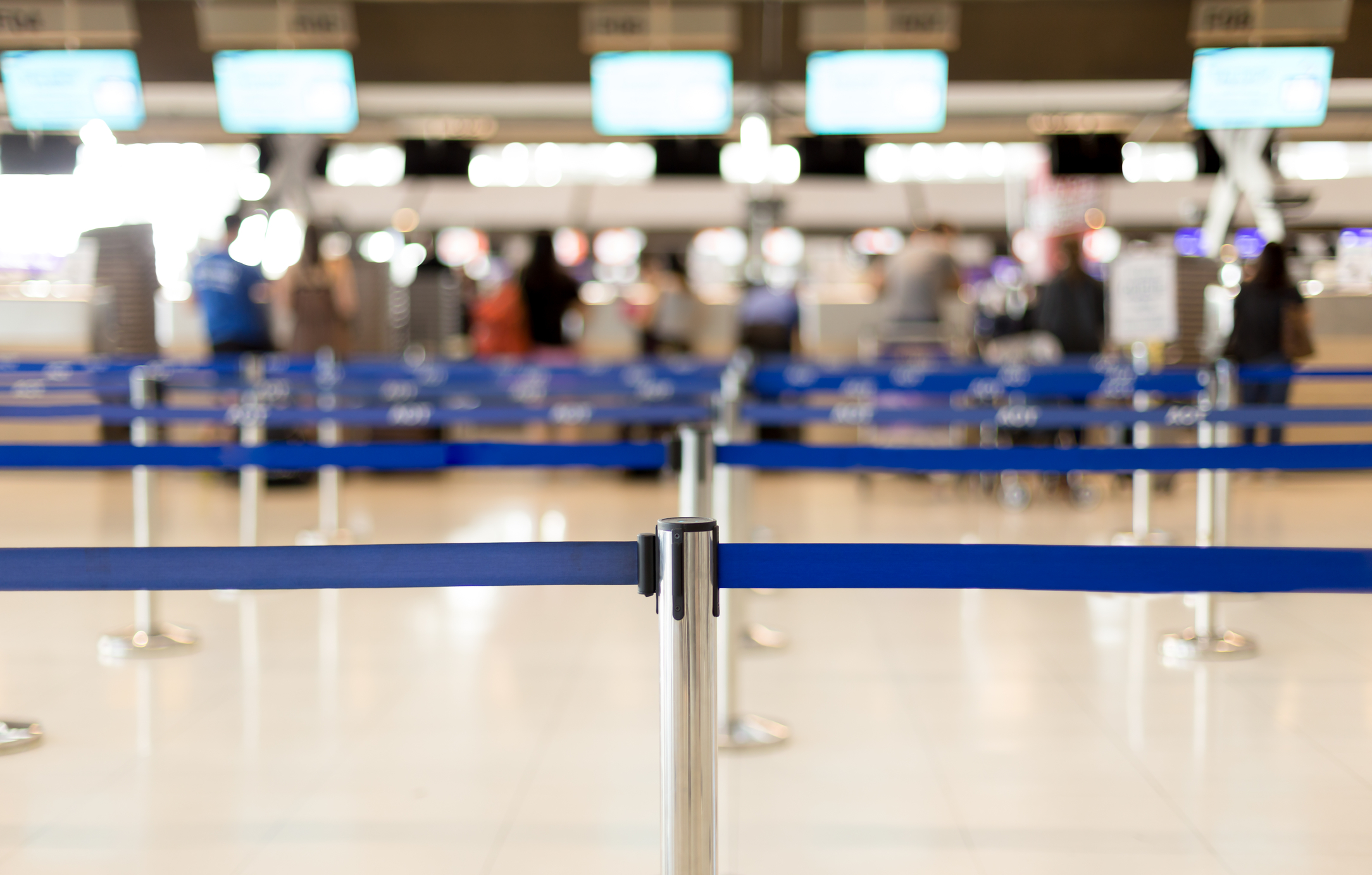 A view of airport security lines, blurry