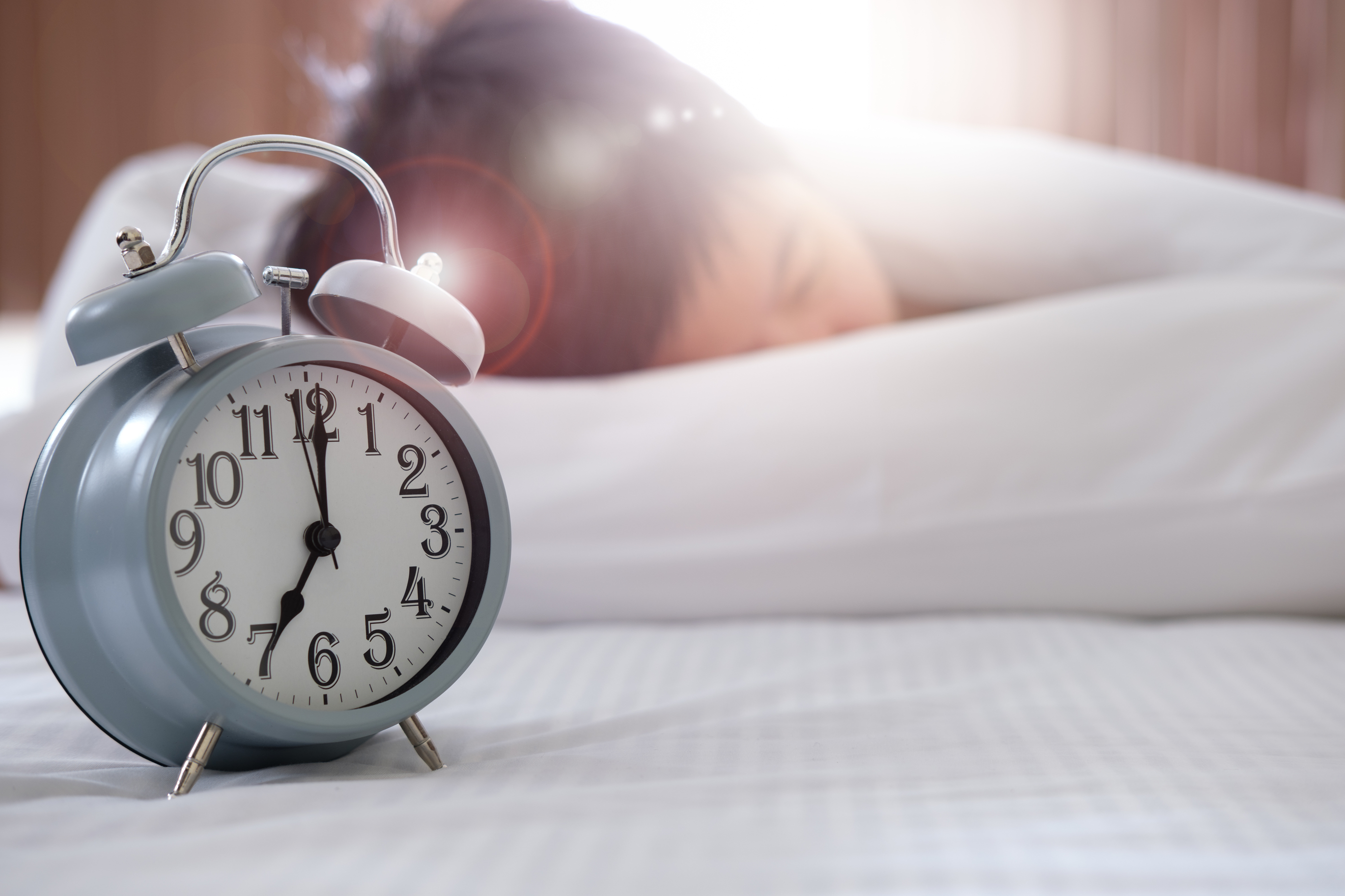 Sleeping woman near clock